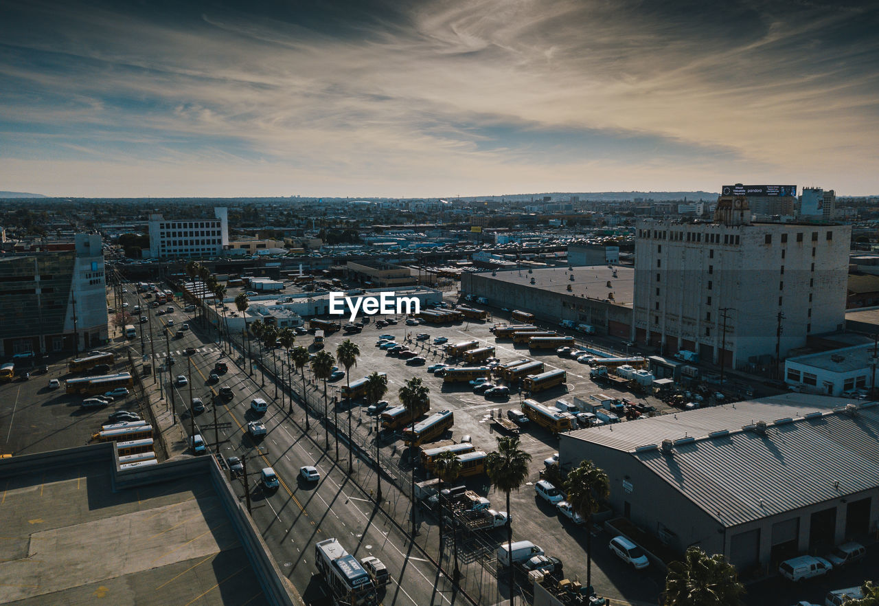 High angle view of street amidst buildings against sky