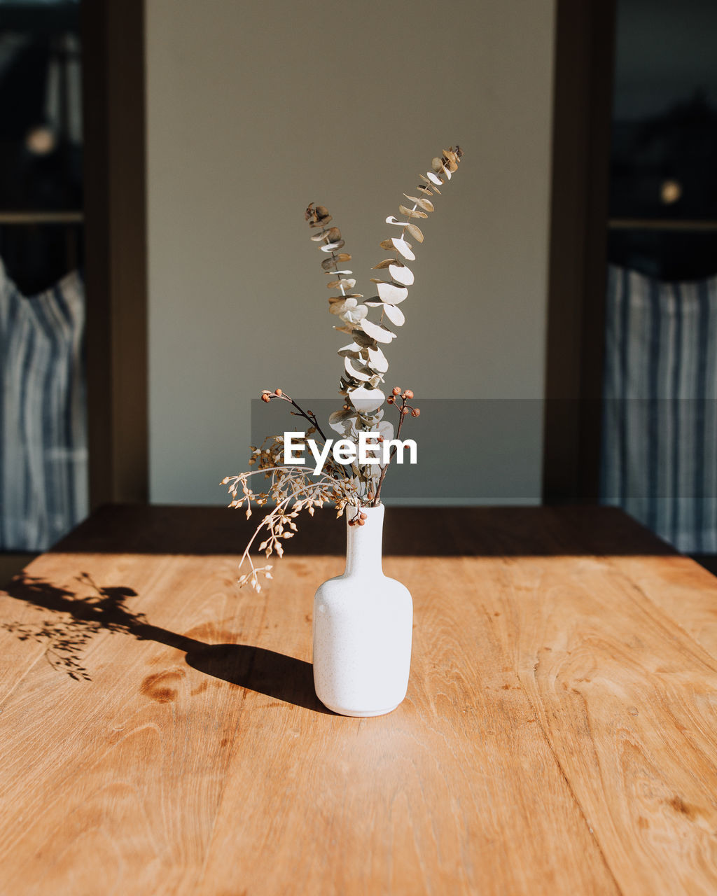 Flowers in vase on table at home