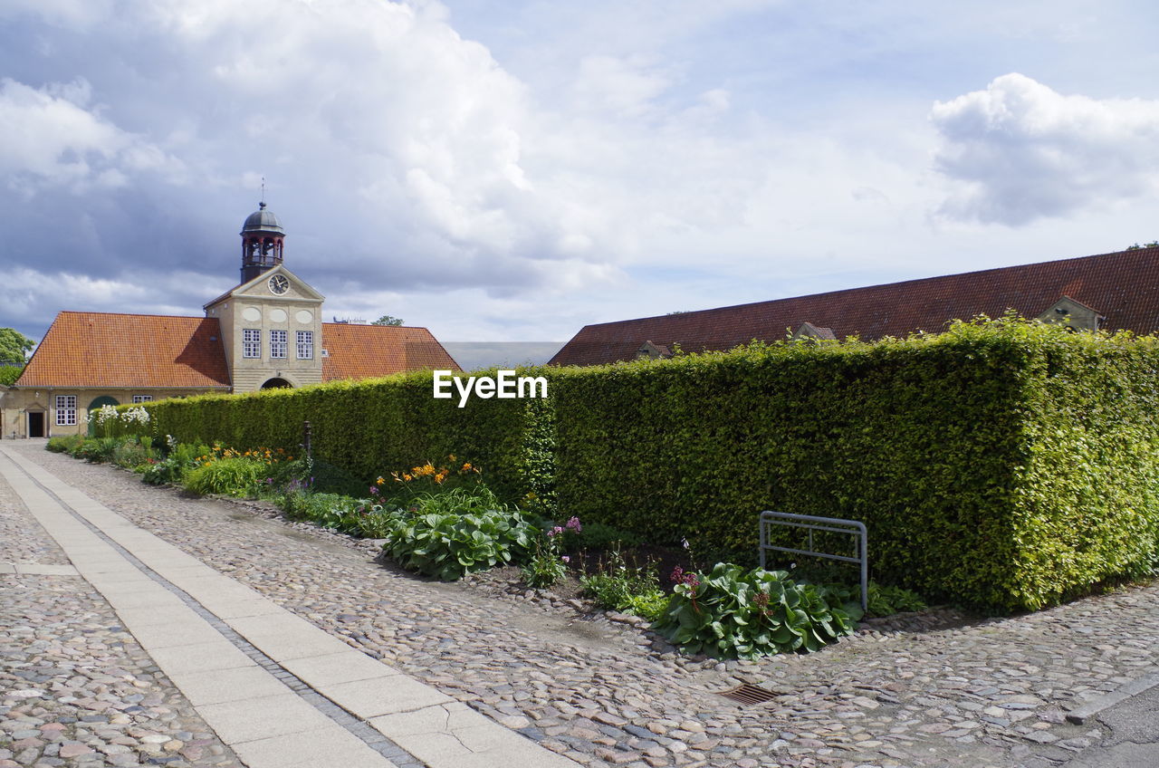 VIEW OF CHURCH AGAINST CLOUDY SKY