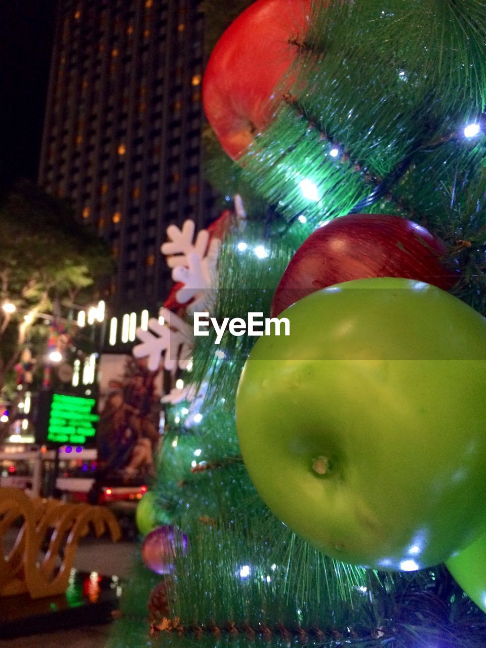 ILLUMINATED CHRISTMAS TREE AT NIGHT DURING FESTIVAL