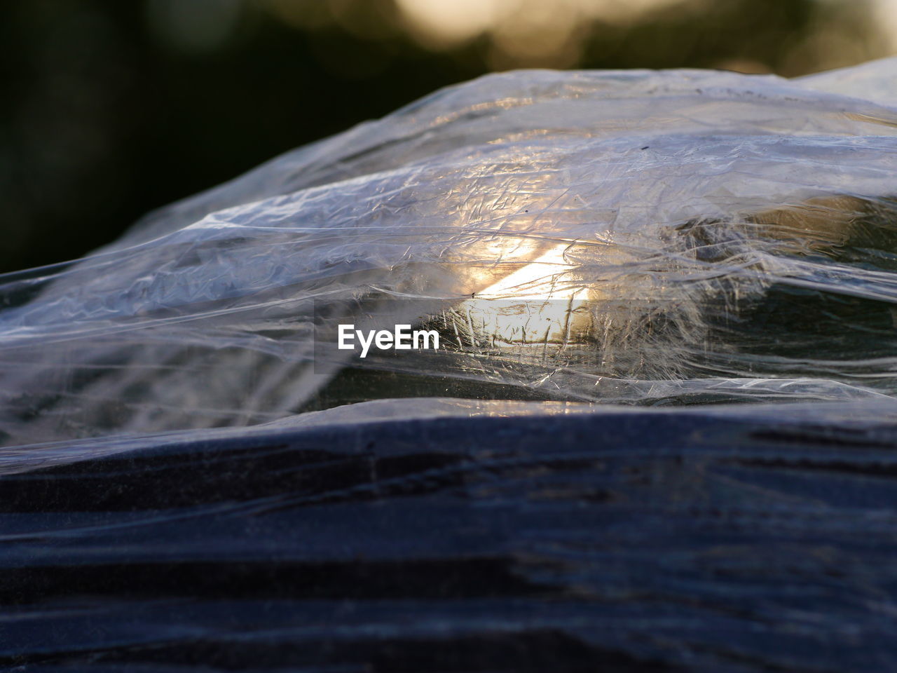 CLOSE-UP OF FROZEN WATER ON LAND