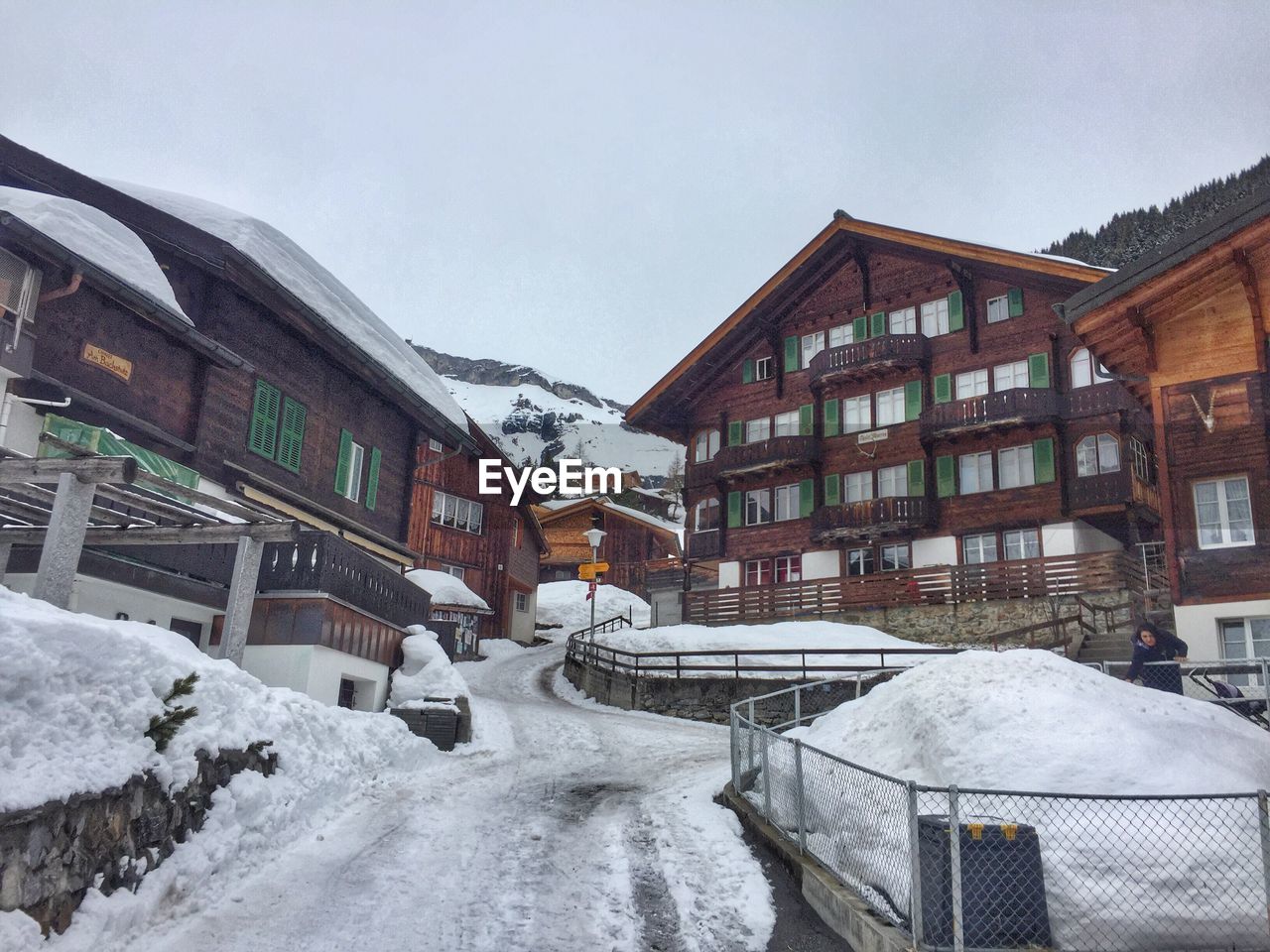 SNOW COVERED HOUSES AGAINST CLEAR SKY