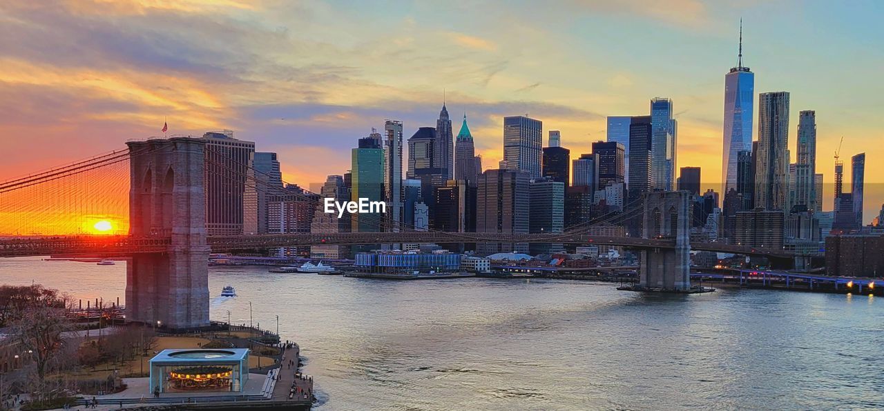 architecture, city, built structure, landscape, building exterior, sunset, office building exterior, sky, skyscraper, urban skyline, skyline, cityscape, transportation, building, water, travel destinations, nature, dusk, urban area, horizon, evening, mode of transportation, landmark, downtown district, nautical vessel, travel, bridge, downtown, residential district, city life, cloud, illuminated, twilight, reflection, office, business finance and industry, vehicle, river, no people, ship, dramatic sky, traffic, business, outdoors, motor vehicle, waterfront, car, tourism, night, scenics - nature, metropolis, tower, street, metropolitan area, panoramic, environment, beauty in nature, motion