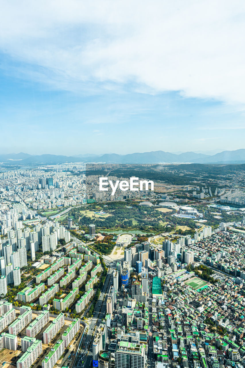 High angle view of buildings in city against sky