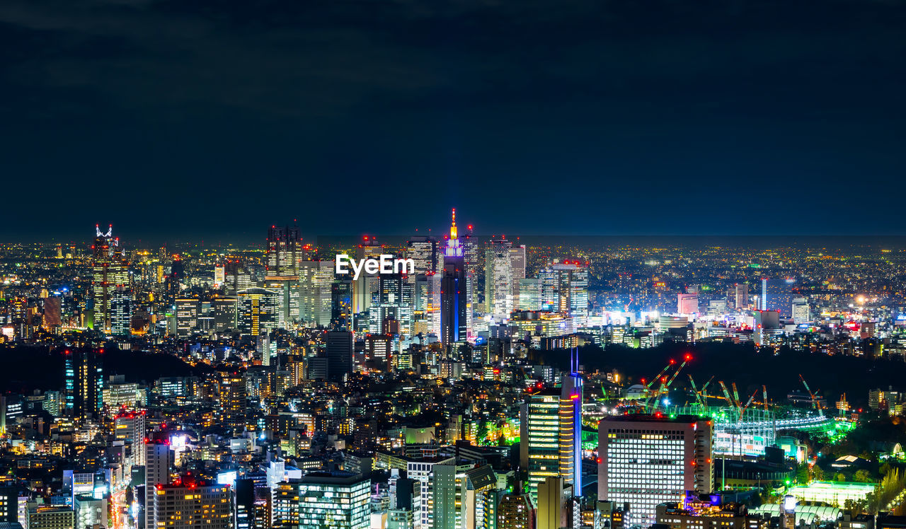 High angle view of illuminated cityscape at night