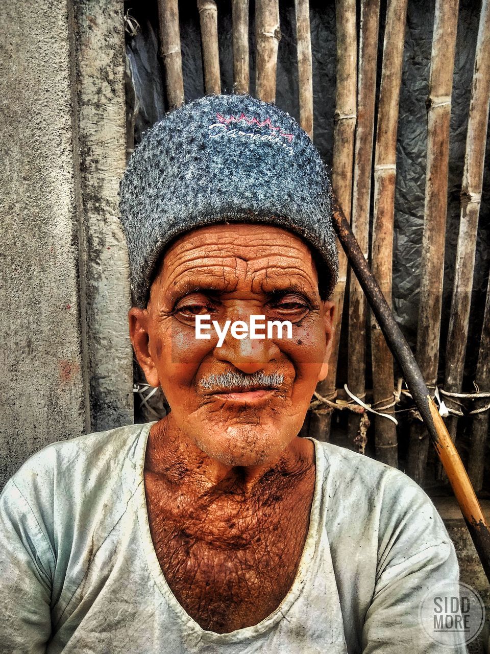 Portrait of senior man wearing hat