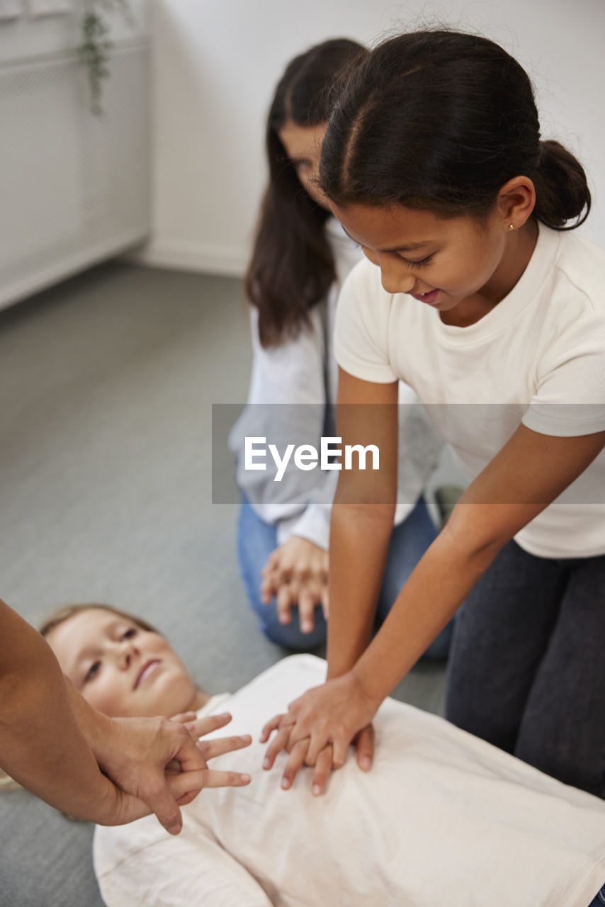 Teacher giving first aid training