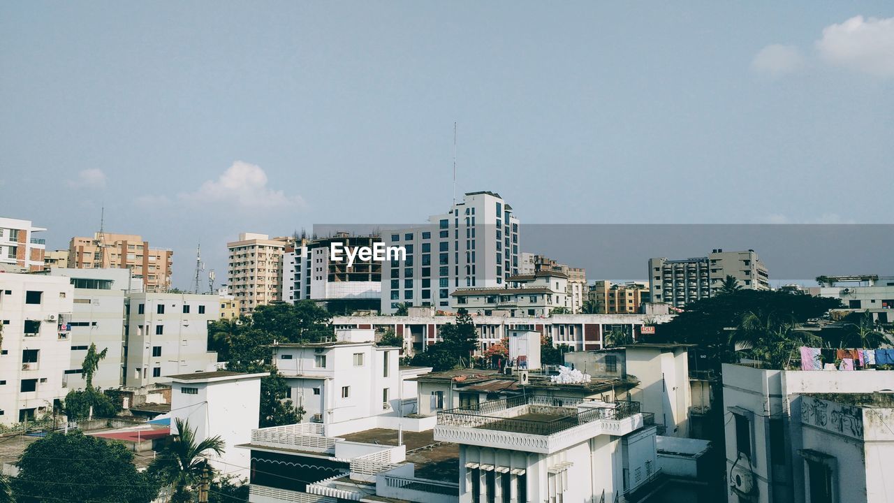 High angle view of buildings in city against sky