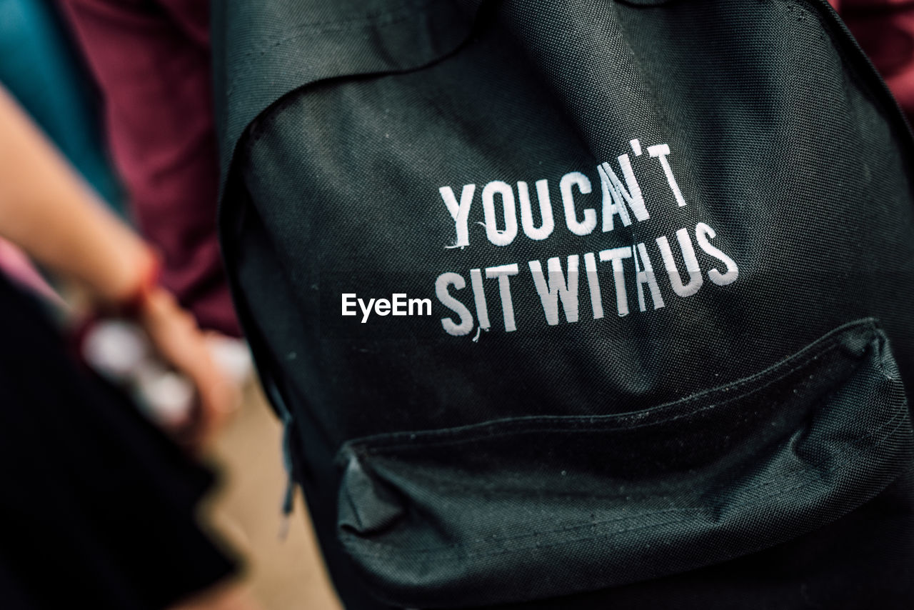 Close-up of backpack with text