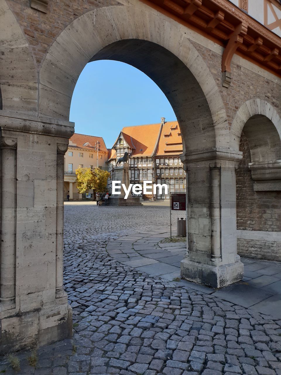 FOOTPATH BY OLD BUILDING AGAINST SKY