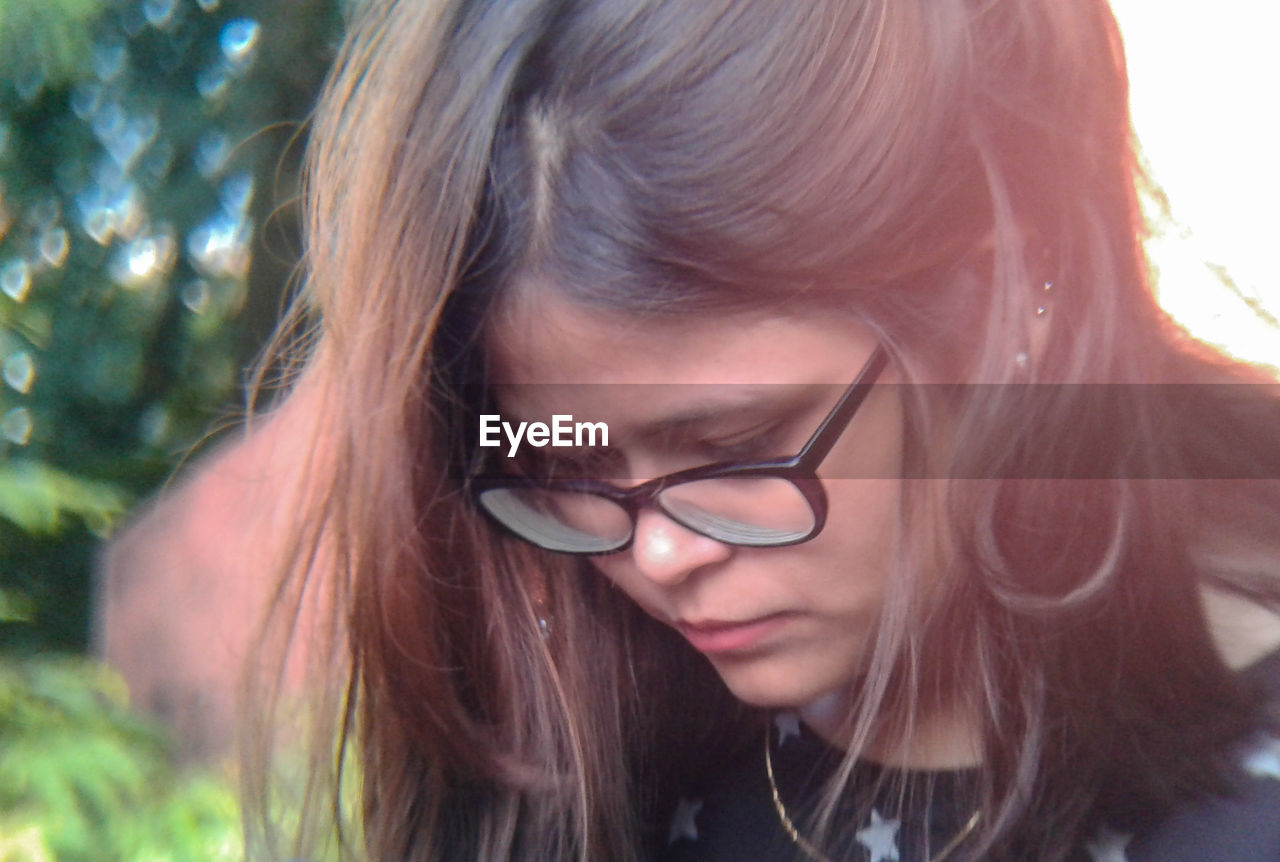 Close-up of thoughtful woman looking down