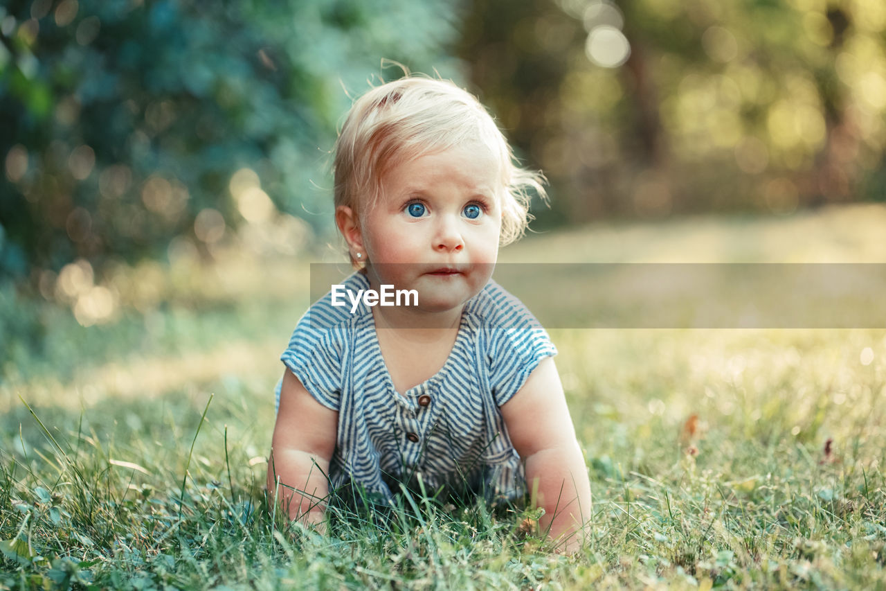 Cute baby crawling at park