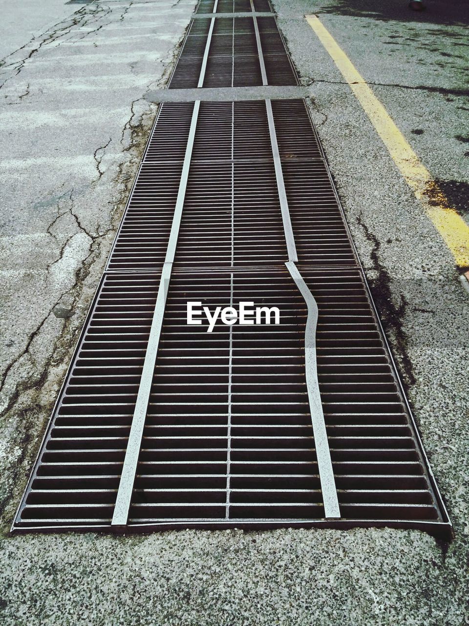 High angle view of sewer amidst street