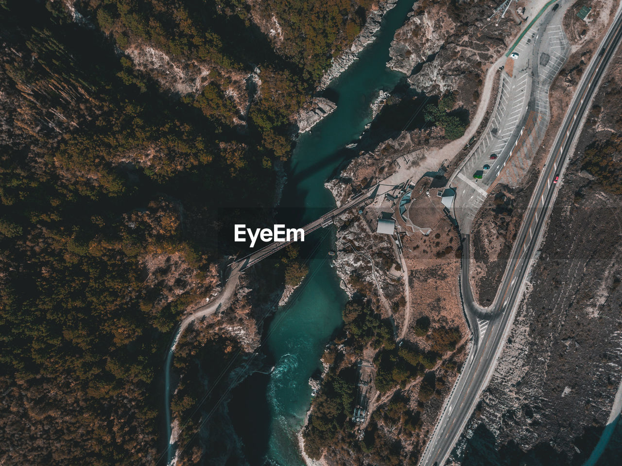 High angle view of bridge over river against trees