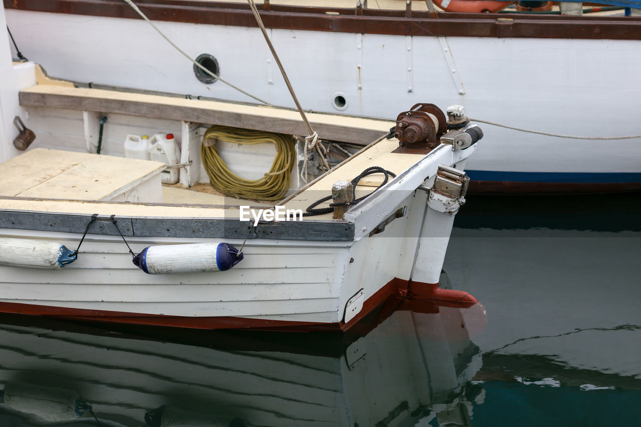 Boats moored at harbor