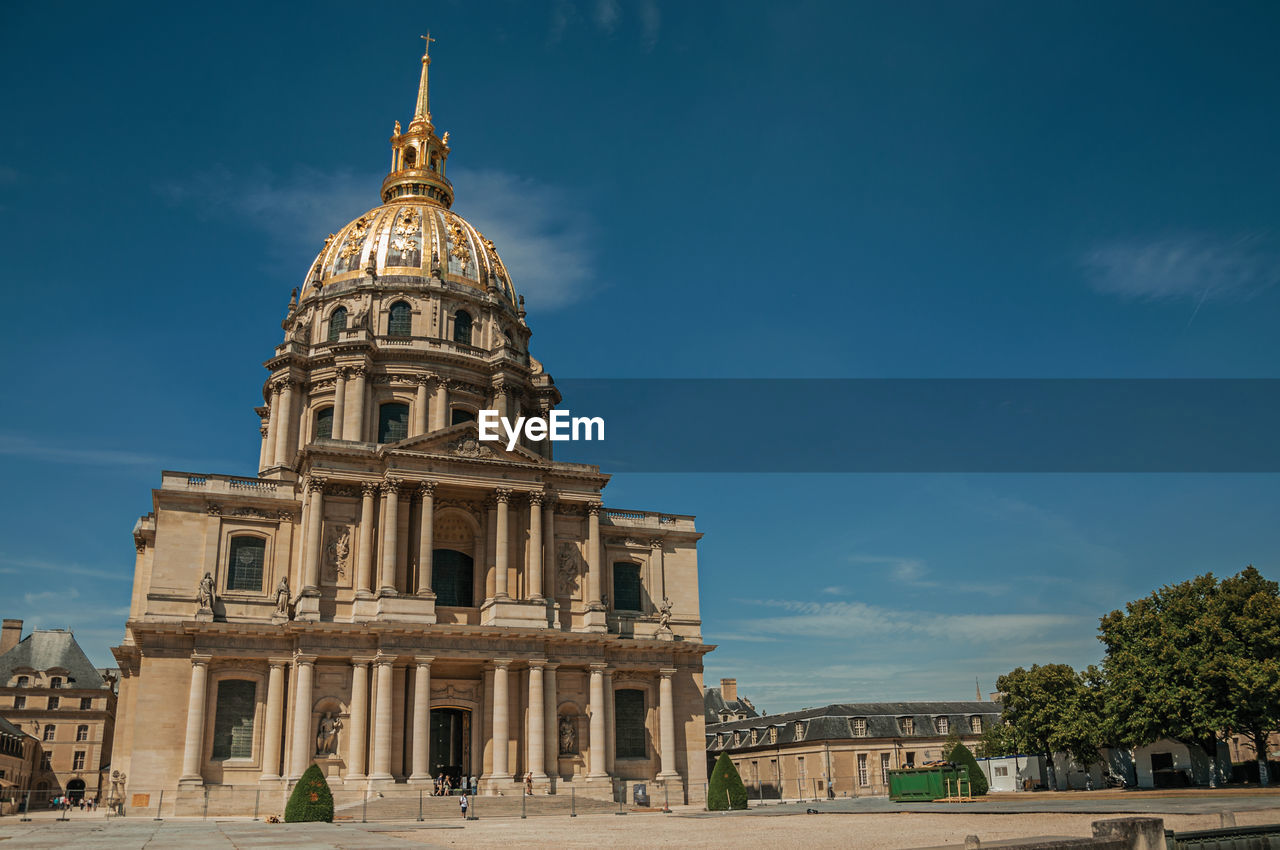 Front facade of les invalides palace with the golden dome in paris. the famous capital of france.