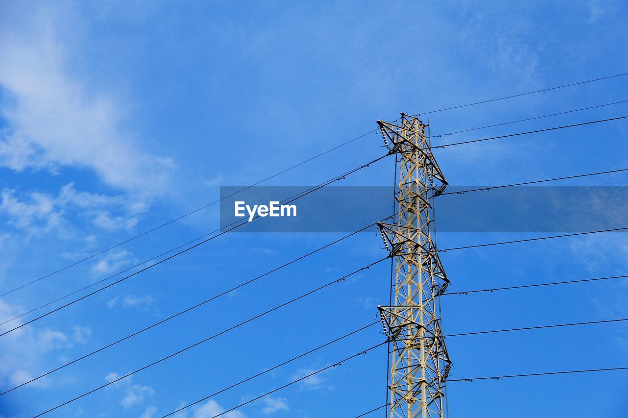 Low angle view of power lines against sky