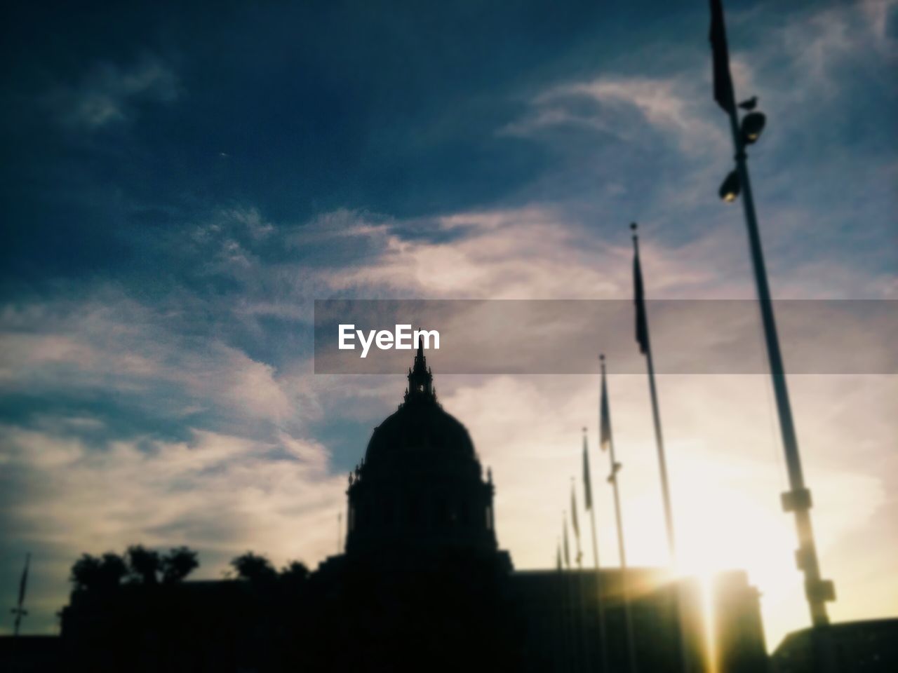 LOW ANGLE VIEW OF CHURCH AGAINST SKY AT SUNSET