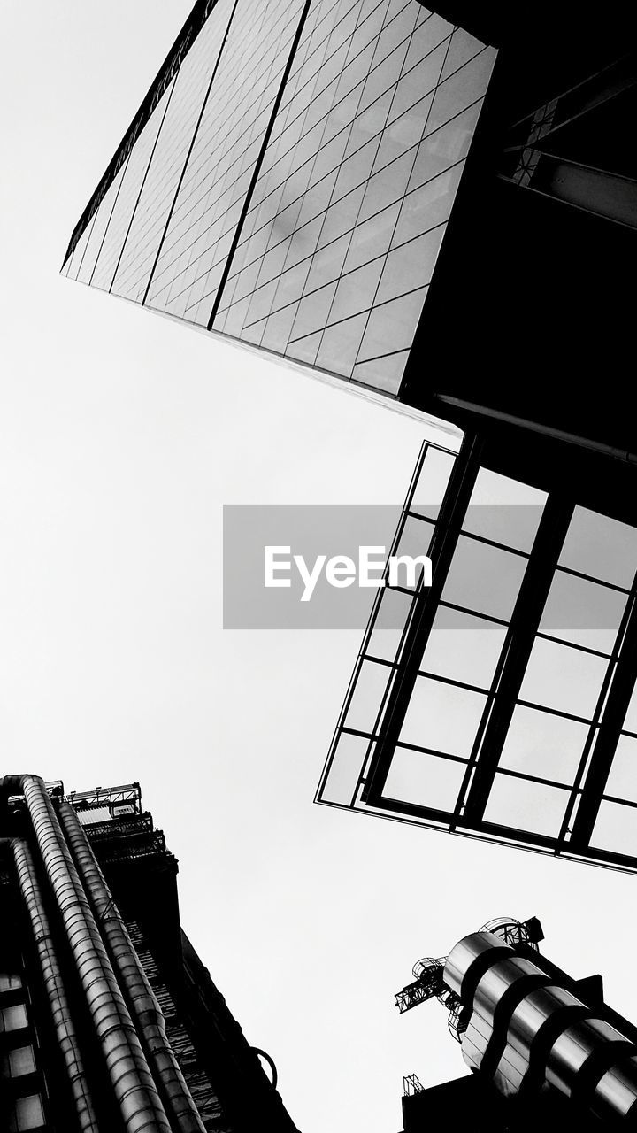 Directly below shot of buildings against sky