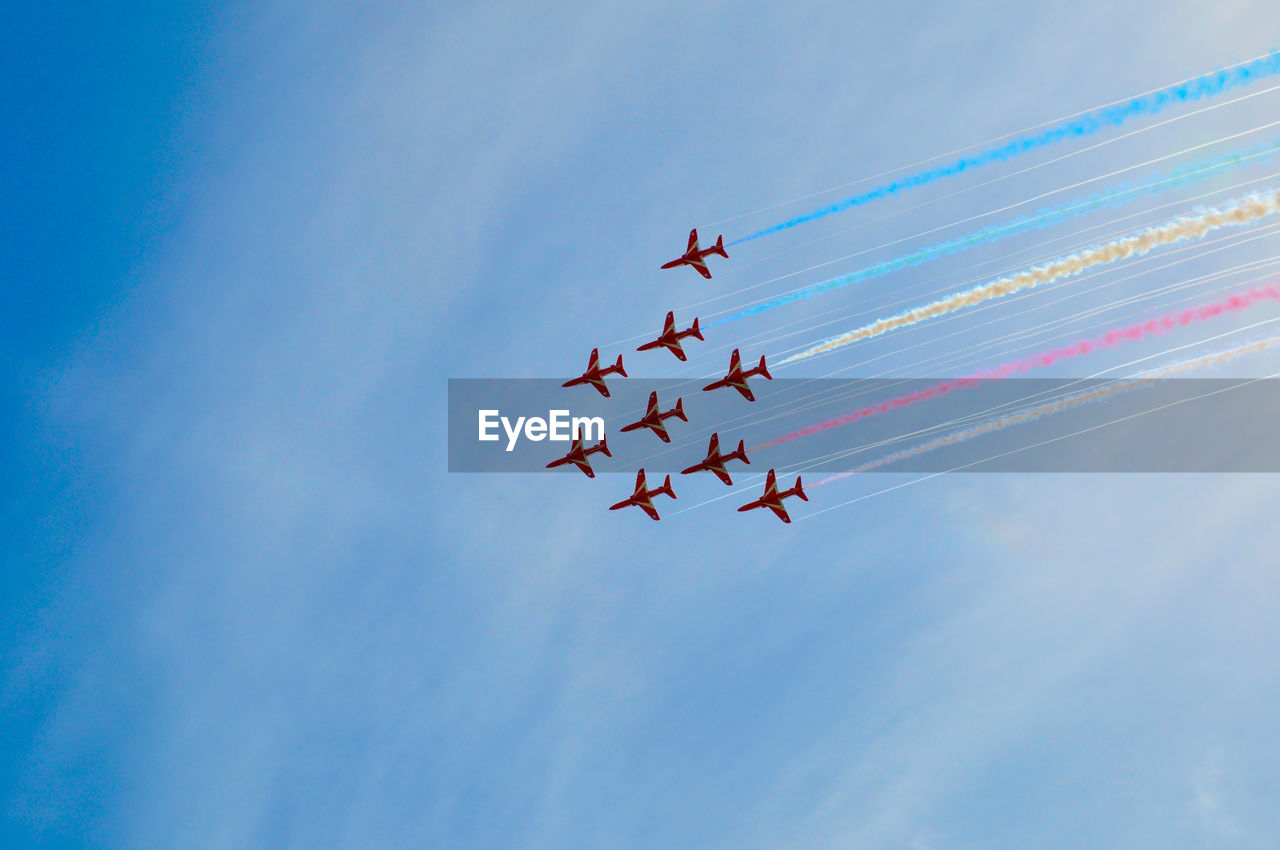 Low angle view of airplanes against sky