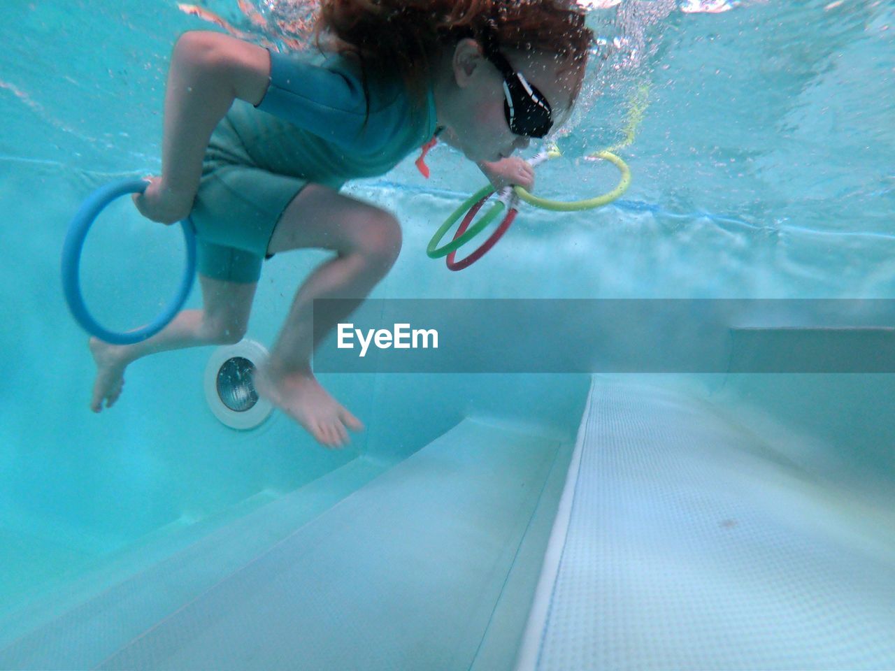 WOMAN SWIMMING IN POOL