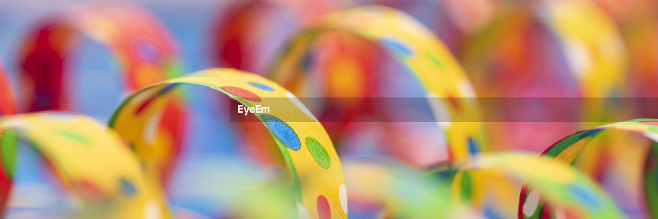 multi colored, close-up, selective focus, macro photography, no people, large group of objects, backgrounds, abundance, yellow, focus on foreground, celebration