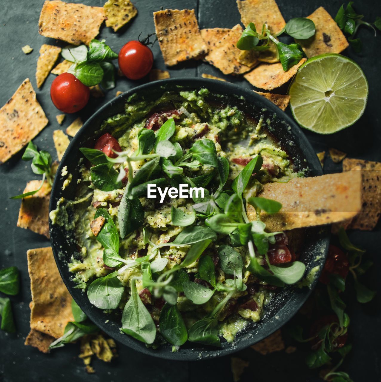 High angle view of salad in plate with crackers