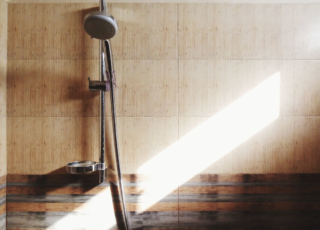 Shower on wall in bathroom