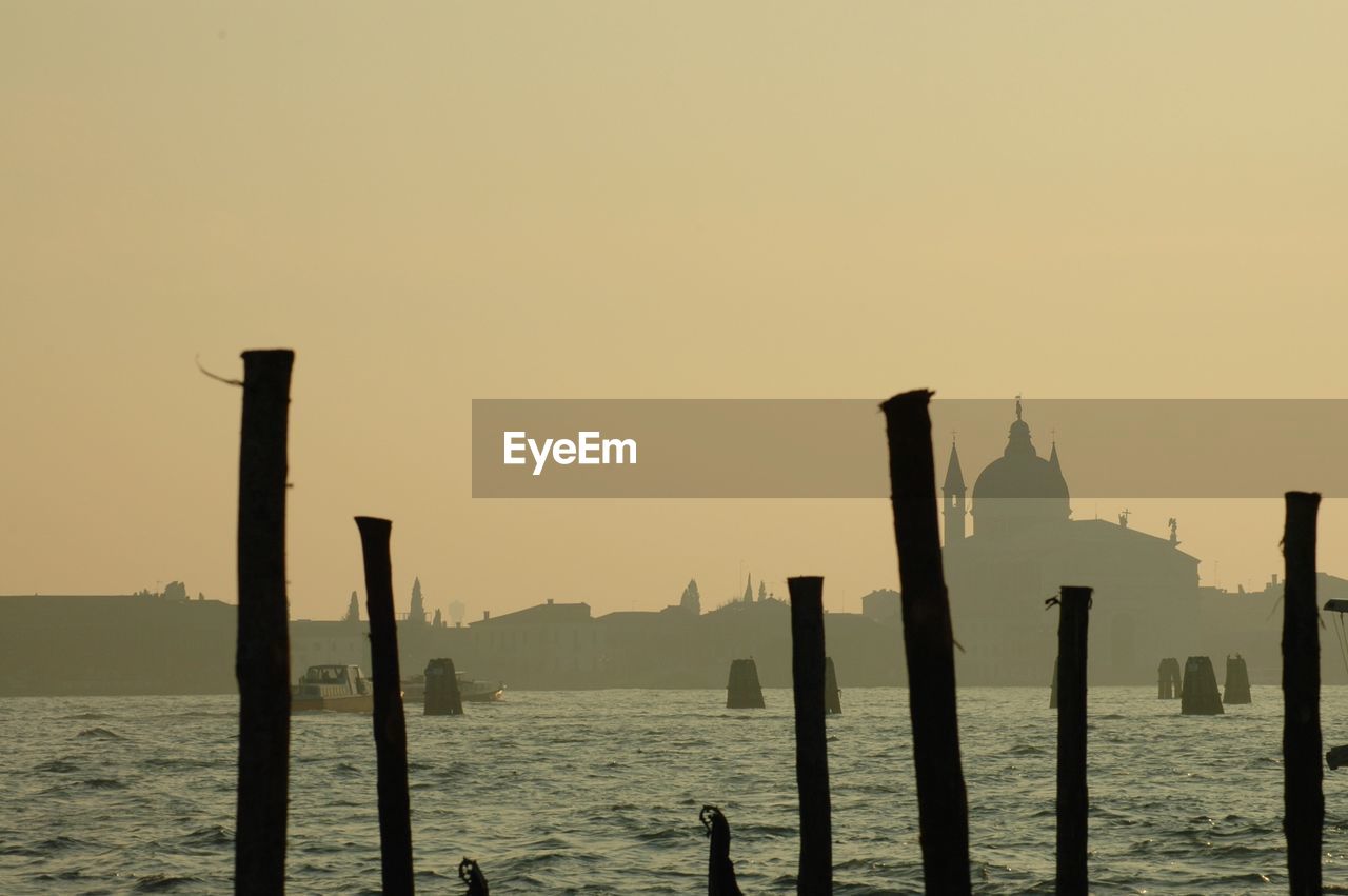 Scenic view of sea against clear sky during sunset