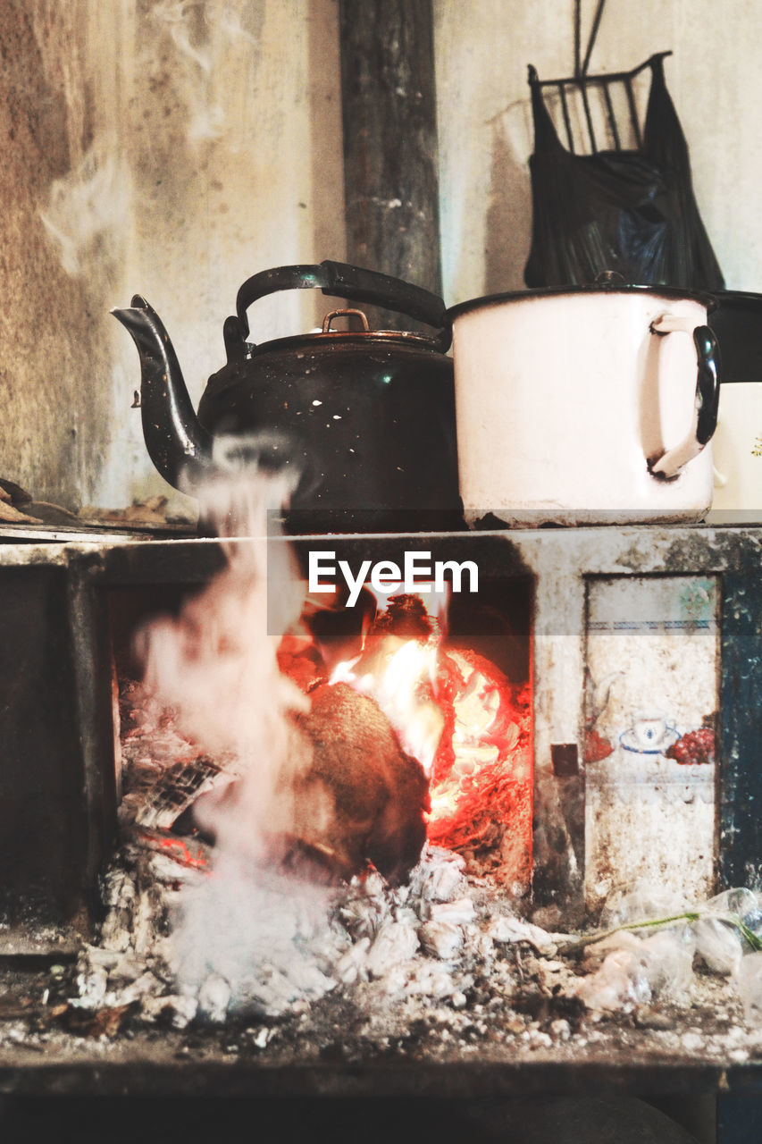 Teapot on burning stove