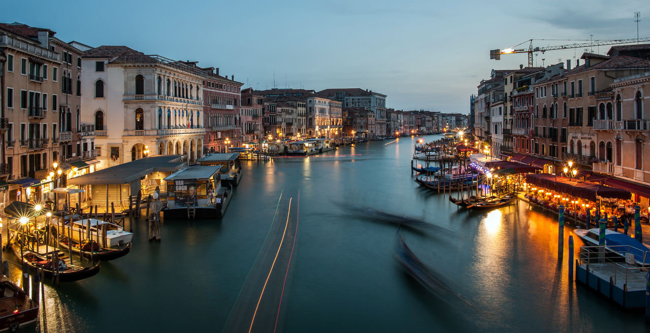 Long exposure of boats on canal at night