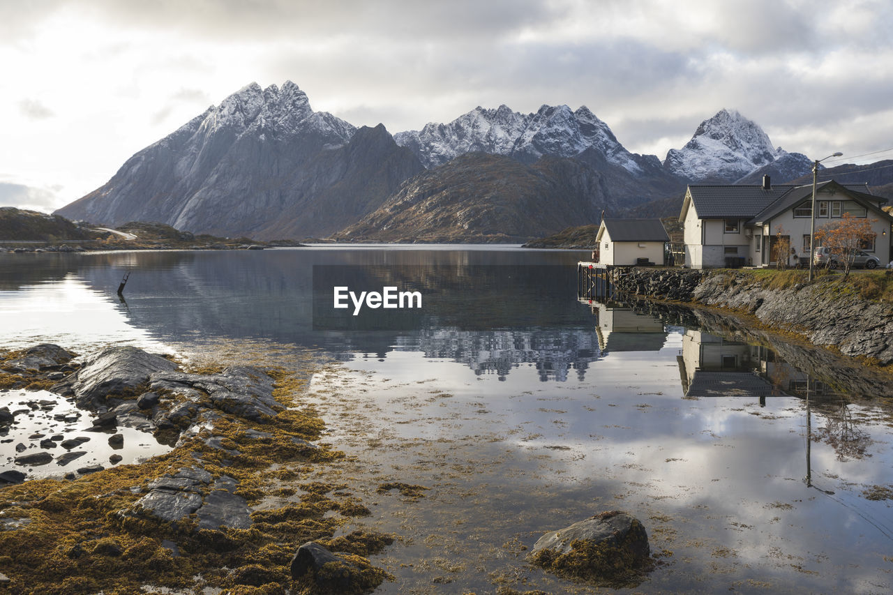 Typical scandinavian house by the lake in autumn