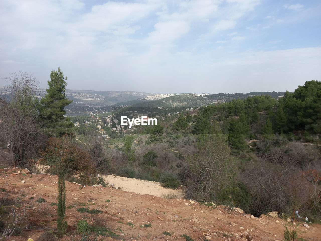 SCENIC VIEW OF LANDSCAPE AND MOUNTAINS AGAINST SKY