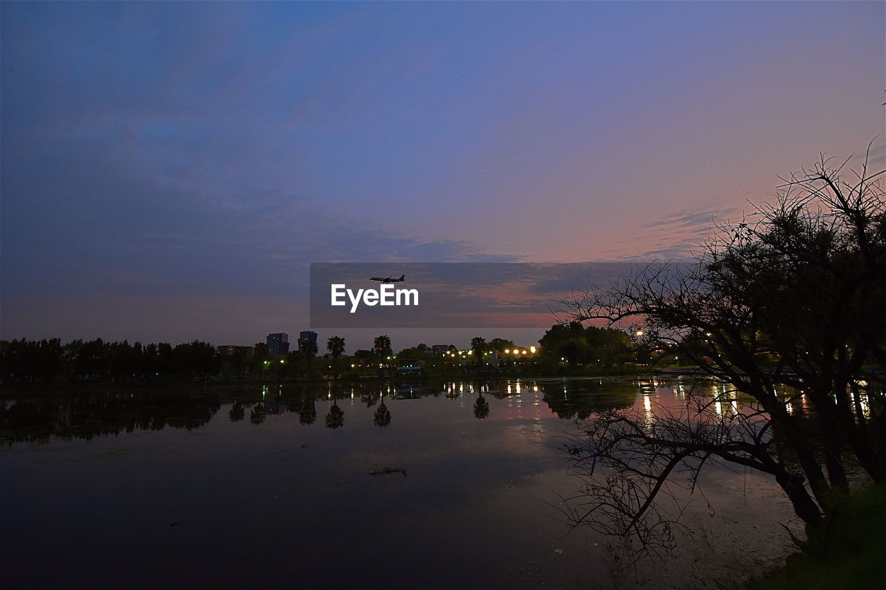 Scenic view of lake against sky during sunset