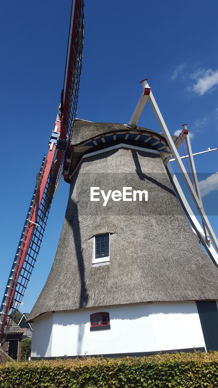 LOW ANGLE VIEW OF WINDMILL AGAINST SKY