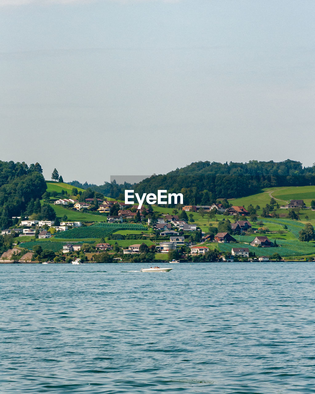 SCENIC VIEW OF SEA AGAINST BUILDINGS