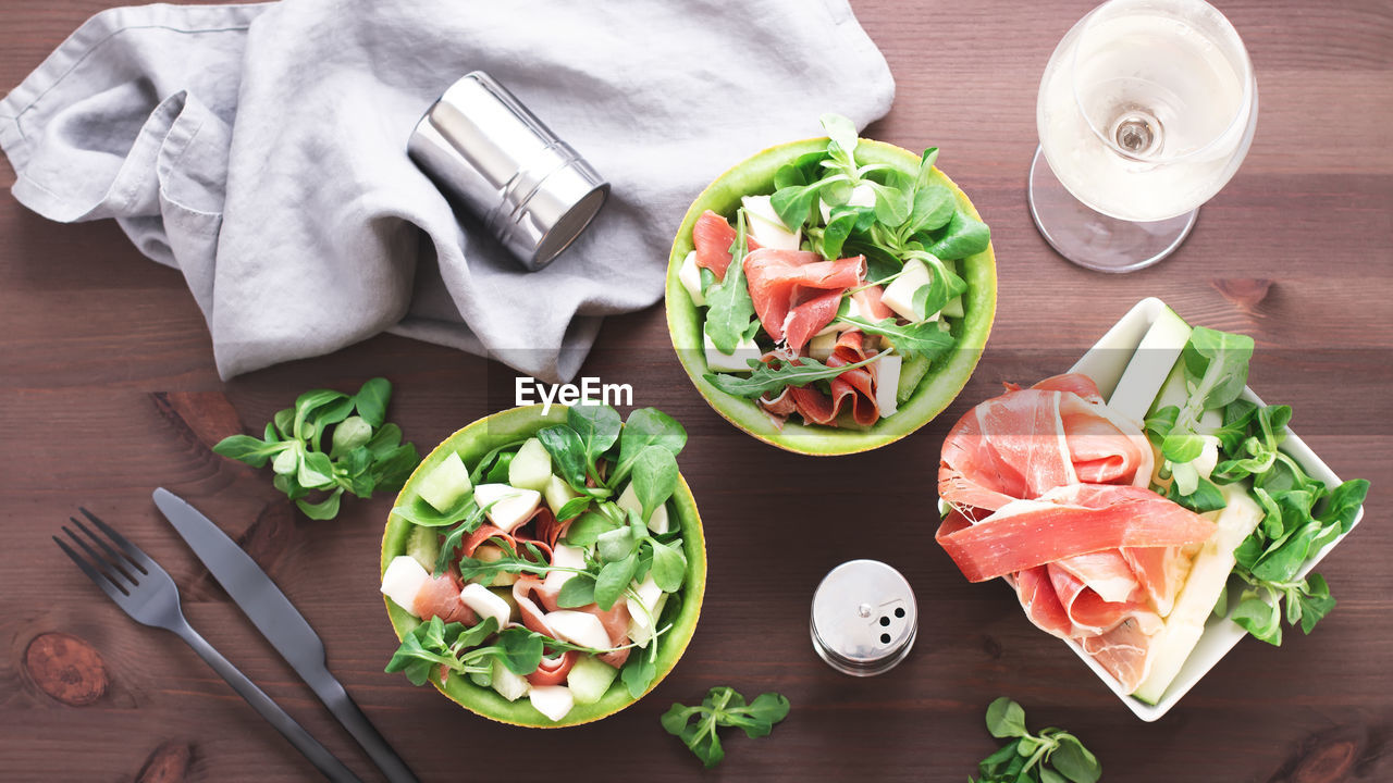 HIGH ANGLE VIEW OF CHOPPED FRUITS ON TABLE