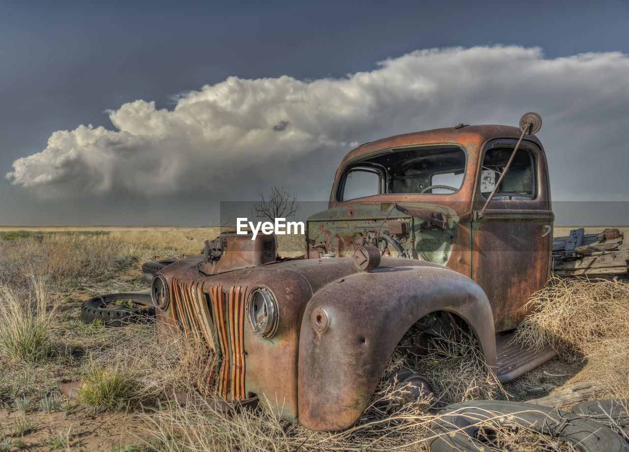 ABANDONED TRUCK ON FIELD