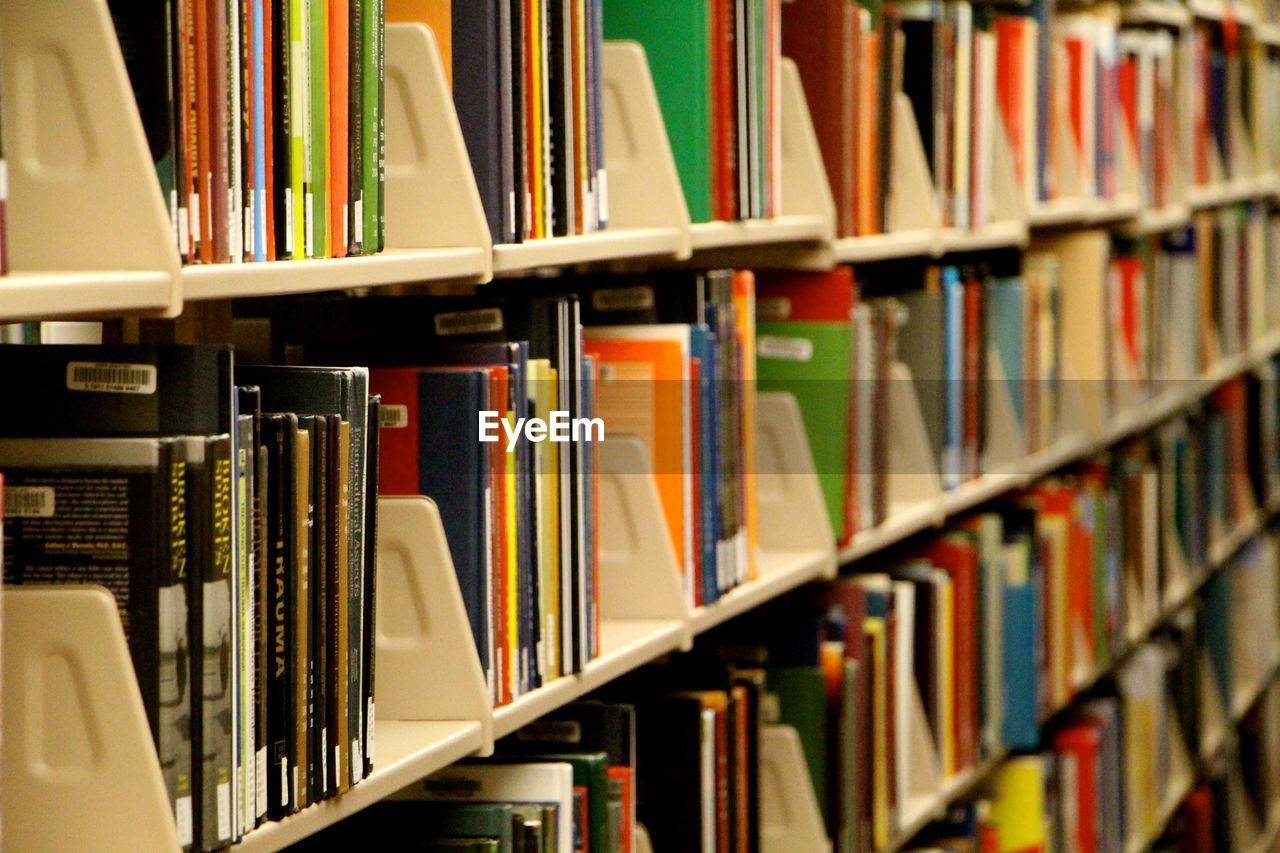 High angle view of book on shelf