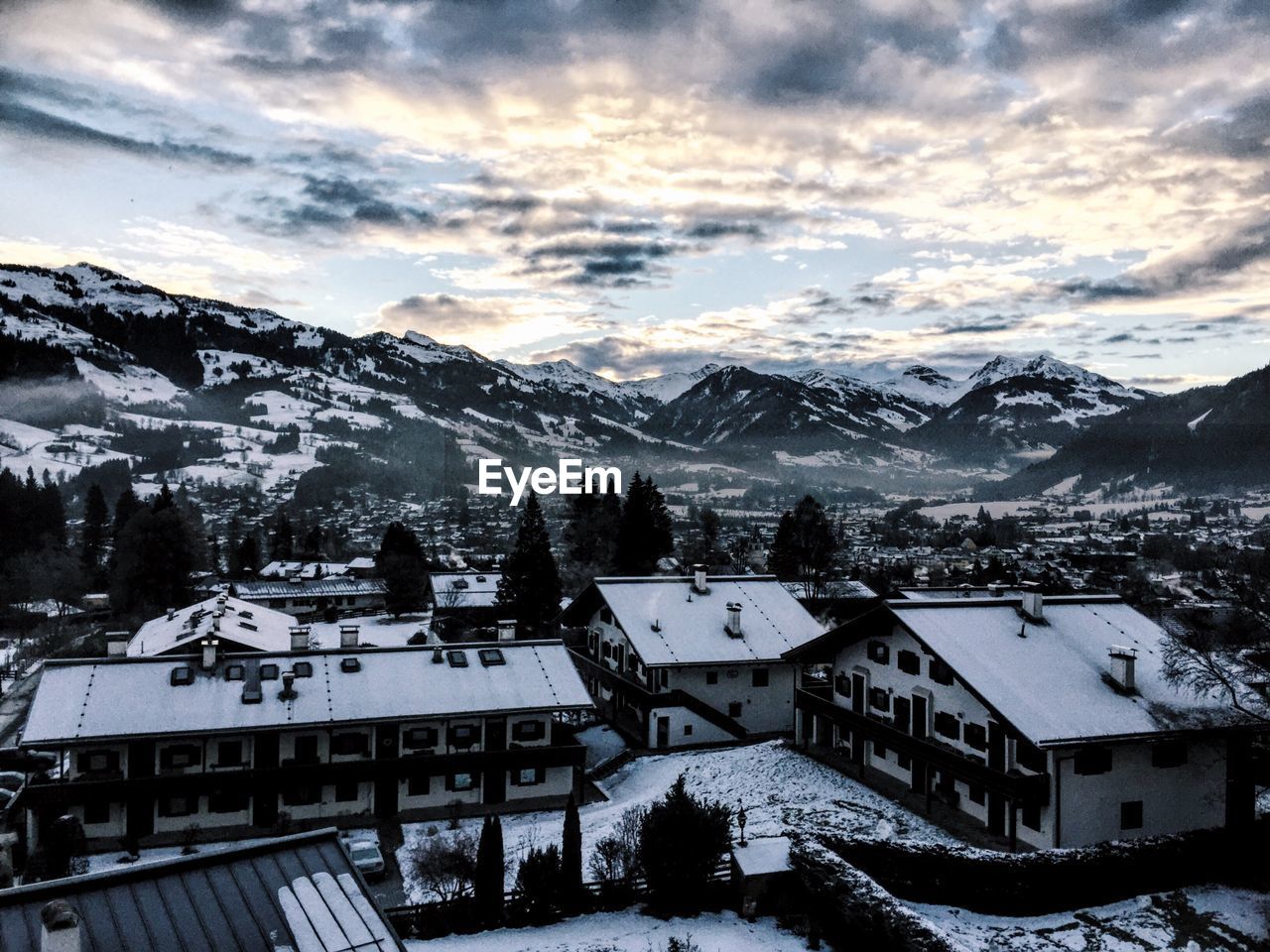 High angle view of snowcapped mountains against sky