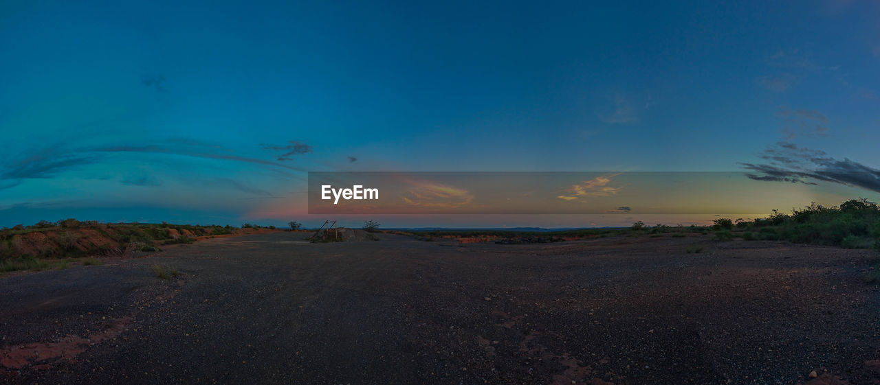 Scenic view of road against sky during sunset