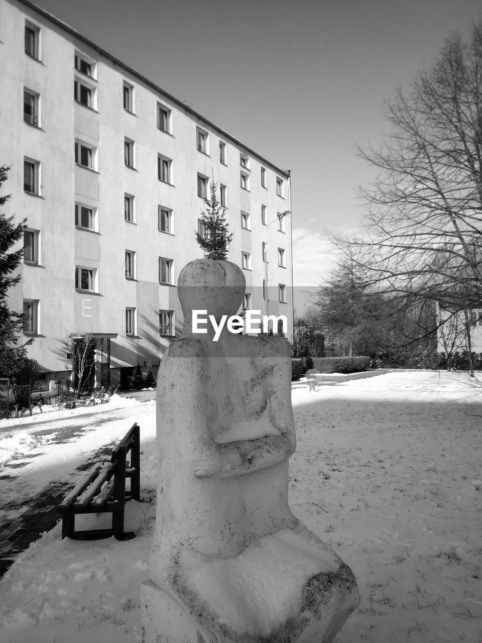 Sculpture outside building during winter