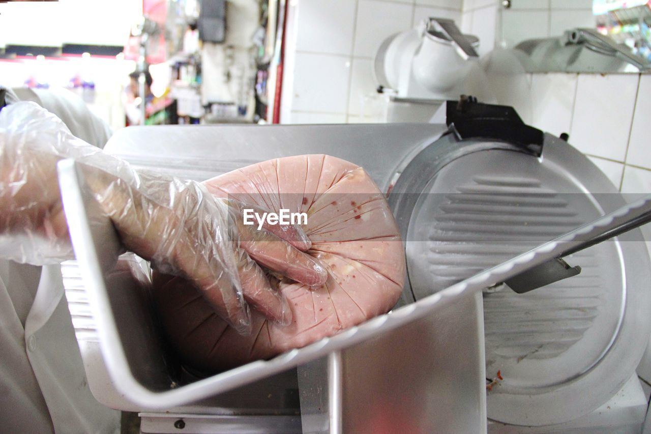 Cropped image of vendor with food at store