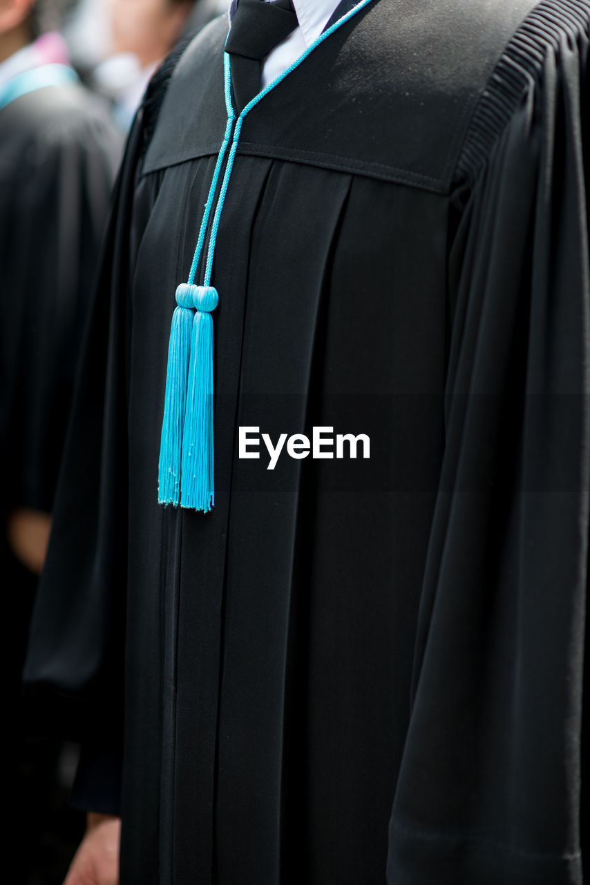 Close-up of graduation gown