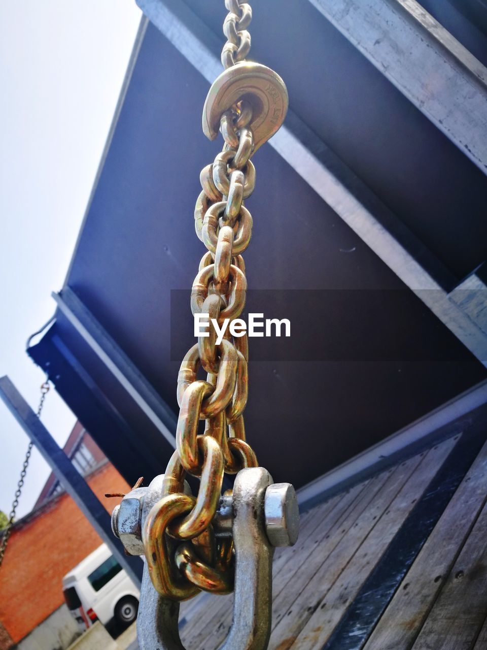 LOW ANGLE VIEW OF CHAIN ON RAILING