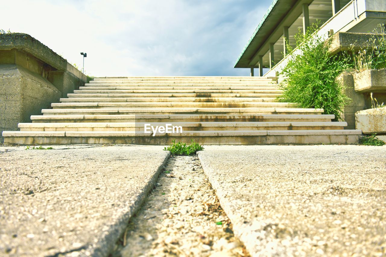 architecture, built structure, staircase, building exterior, walkway, steps and staircases, sky, nature, building, wall, stairs, cloud, day, house, no people, outdoors, sunlight, plant, city, residential district, low angle view, the way forward, mansion