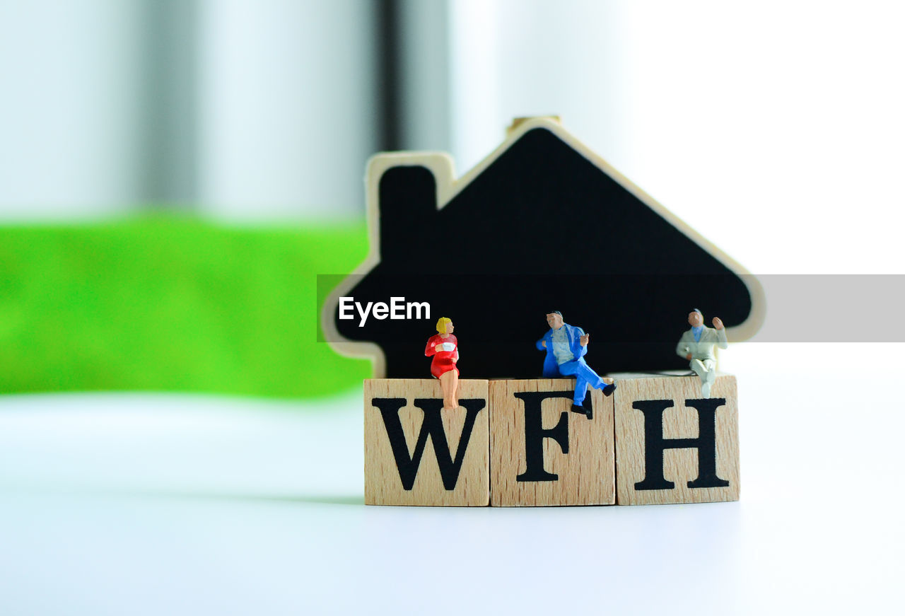 CLOSE-UP OF TOYS ON TABLE WITH TEXT