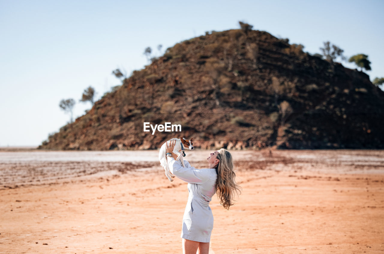 Full length of woman standing on beach