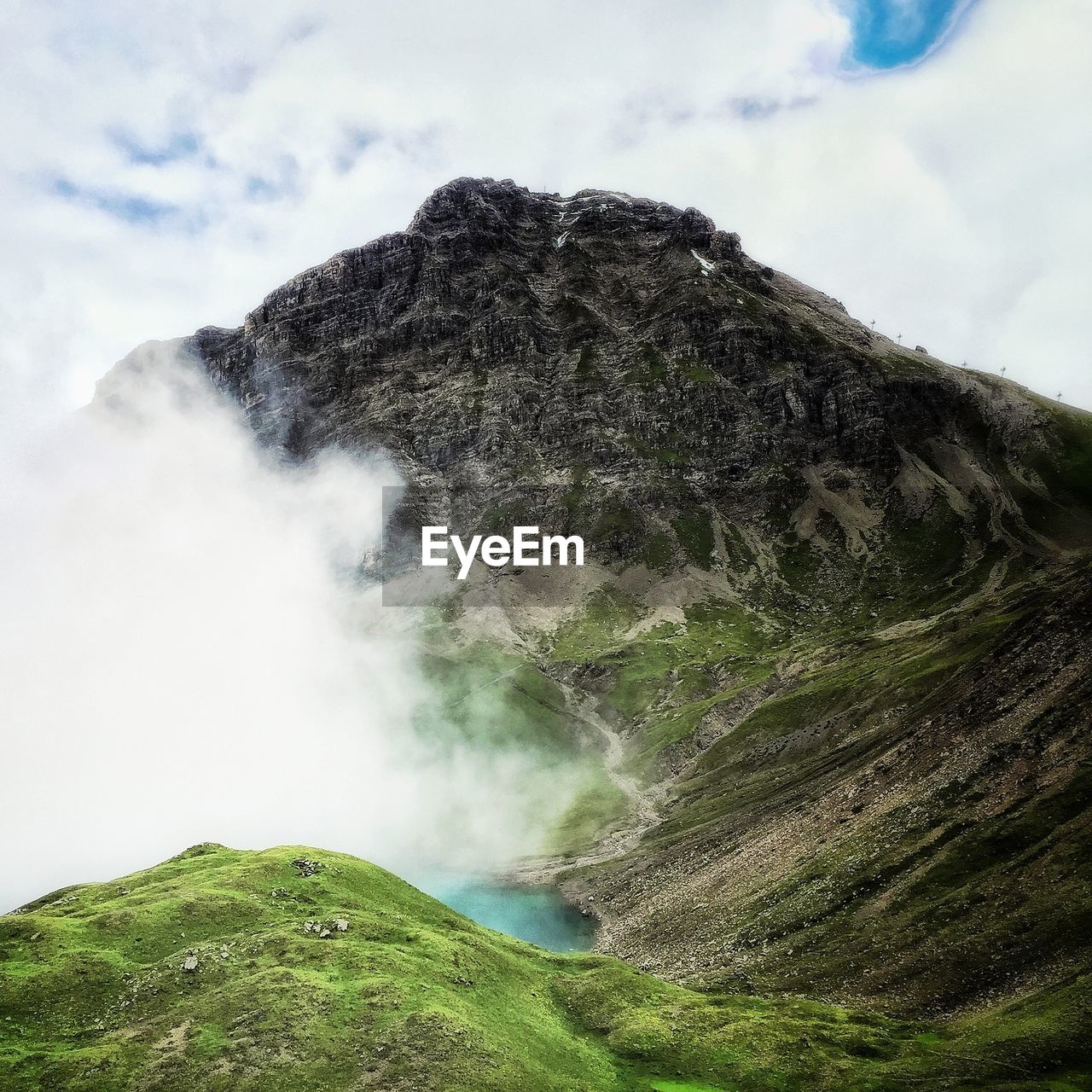 Scenic view of volcanic mountain against sky