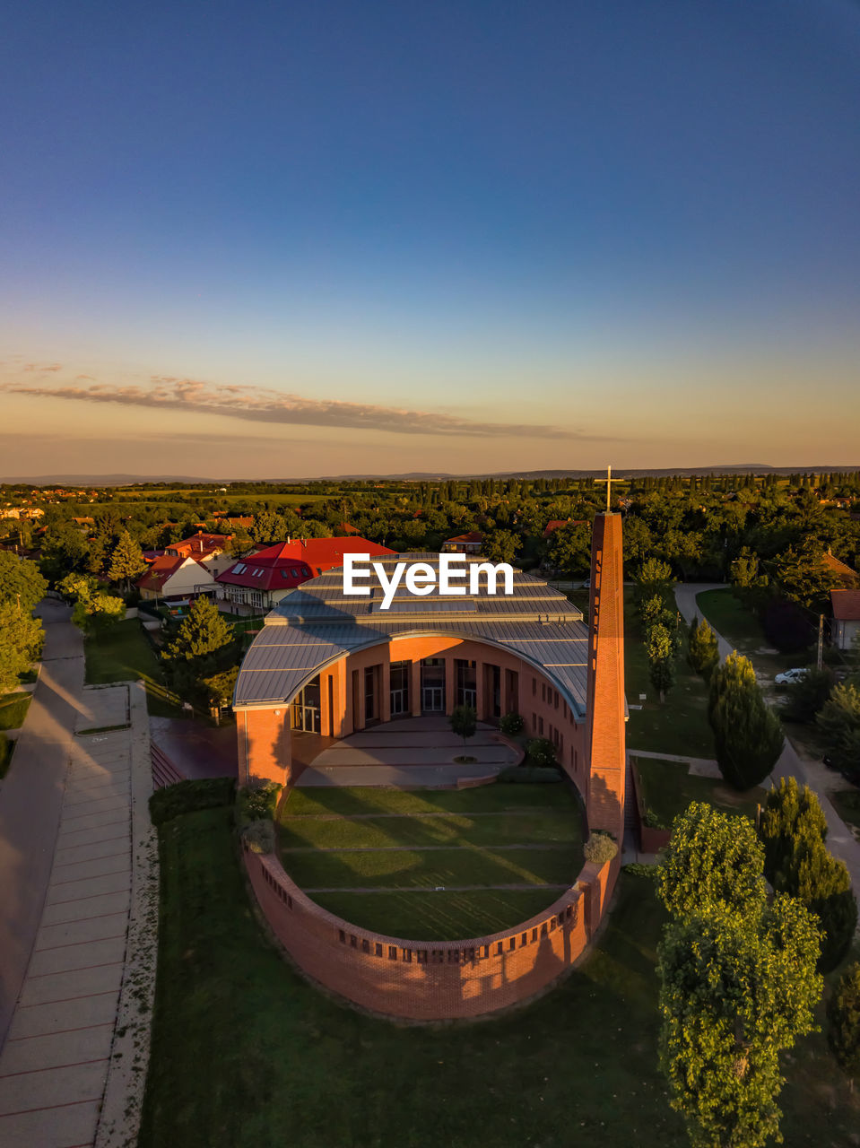 High angle view of buildings against blue sky